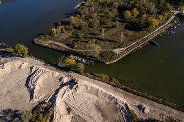 Entrance to the river port on the Vistula River in Poland - Eastern Europe, heaps of sand extracted from the river
