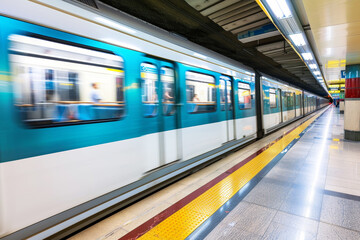 Obraz premium Subway train in motion blur. Motion blur of train in subway station