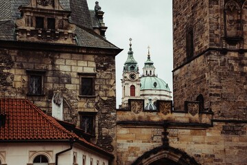 Obraz premium St Nicholas Bell Tower of Prague under a cloudy sky.