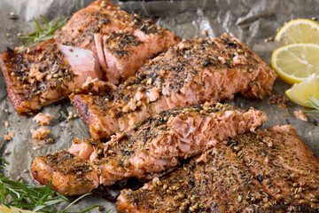 baked salmon fillet on baking tray, top view