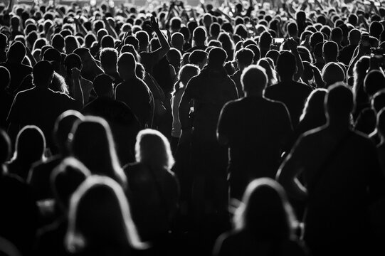 Crowd of people in front of the stage during the concert.