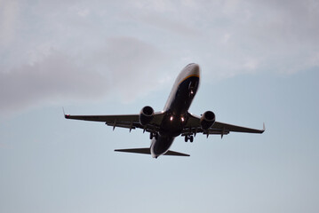 Passenger Airplane Landing Take-Off at Sunrise Dawn