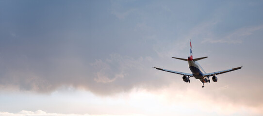 Passenger Airplane Landing Take-Off at Sunrise Dawn