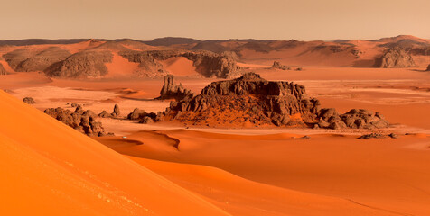 Sand dunes and rocks in the Sahara Desert, Algerian part in the Tadrart and Tassili n'Ajjer...