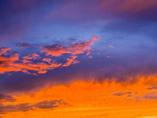 Sunset sky with fiery glowing clouds