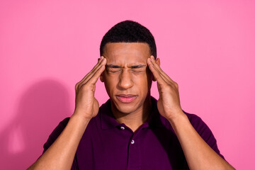 Photo portrait of attractive young man touch temples migraine dressed stylish violet clothes isolated on pink color background