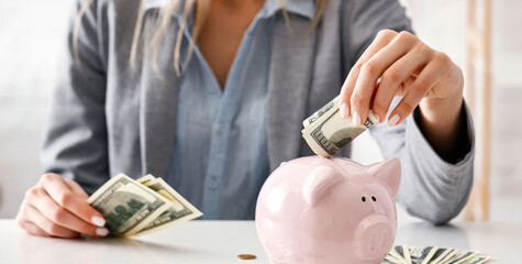 Girl puts money in piggy bank. Protection of finance during quarantine