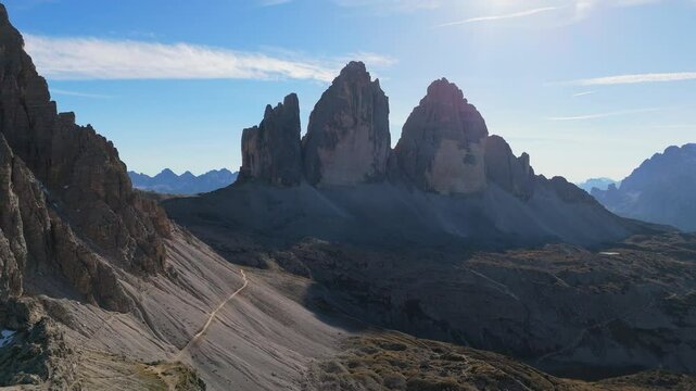 Tre Cime / Drei Zinnen mountain as seen from the refugio Locatelli, Dolomites, Italy, drone video, aerial footage