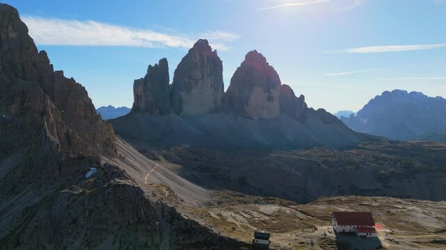 Tre Cime / Drei Zinnen mountain as seen from the refugio Locatelli, Dolomites, Italy, drone video, aerial footage