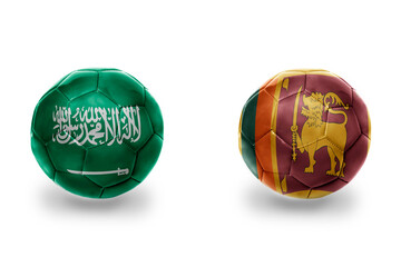 football balls with national flags of sri lanka and saudi arabia ,soccer teams. on the white...
