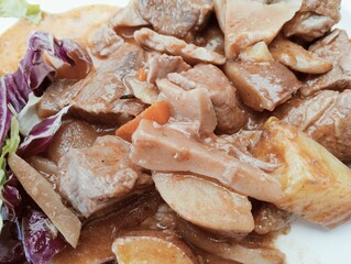 stew dish with potato and mushroom sauce