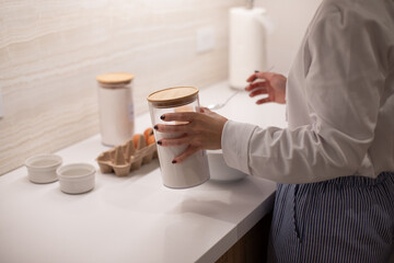 Woman at home in her kitchen cooking, woman hands, culinary blog, step-by-step recipe for cooking a dish, breakfast , recipe, plate and whisk for preparing breakfast