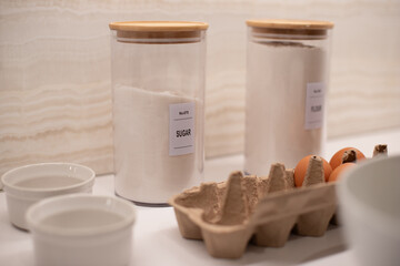 ingredients for cooking, breakfast, step-by-step cooking, eggs, plate, whisk for whipping, flour, baking ingredients on the kitchen table, ingredients for pancake, crepes 