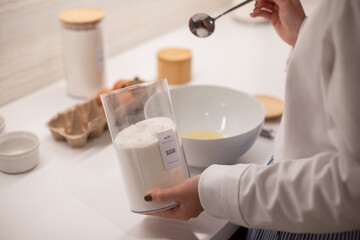 Woman at home in her kitchen cooking, woman hands, culinary blog, step-by-step recipe for cooking a dish, breakfast , recipe, plate and whisk for preparing breakfast