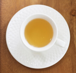 cup of tea on wooden table in coffee shop