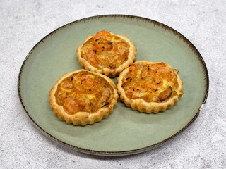 Seafood and bakery. Closeup view of three shrimp pies with gratin cheese