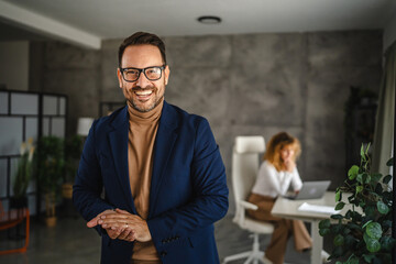 Portrait of adult man businessman stand in the office