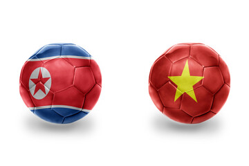 football balls with national flags of vietnam and north korea ,soccer teams. on the white background.