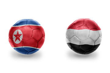 Fototapeta premium football balls with national flags of yemen and north korea ,soccer teams. on the white background.