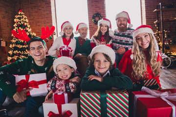 Photo of big full family hold presents smile celebrate christmas eve festive time apartment indoors