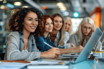 Diverse Business Women Collaborating on Projects in Modern Office