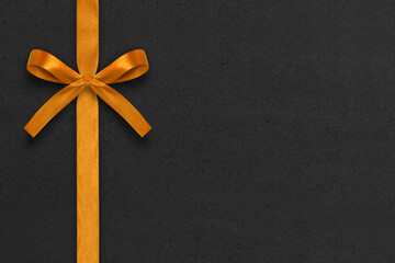 Gold gift ribbon and bow with black background