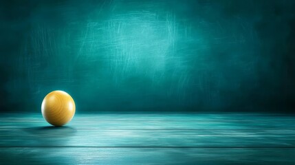 Rustic charm, a single yellow spherical ball on wooden table against vibrant green backdrop