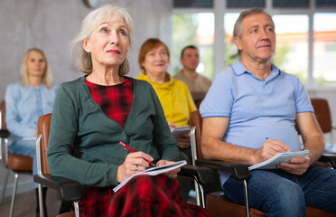 Elderly people study in the classroom on refresher courses
