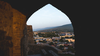 A city view through a stone arch picturesque panorama