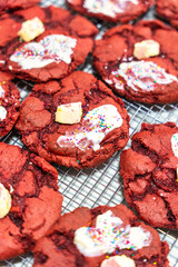 Enjoy these absolutely delicious Red Velvet Cookies adorned with Cream and vibrant Sprinkles