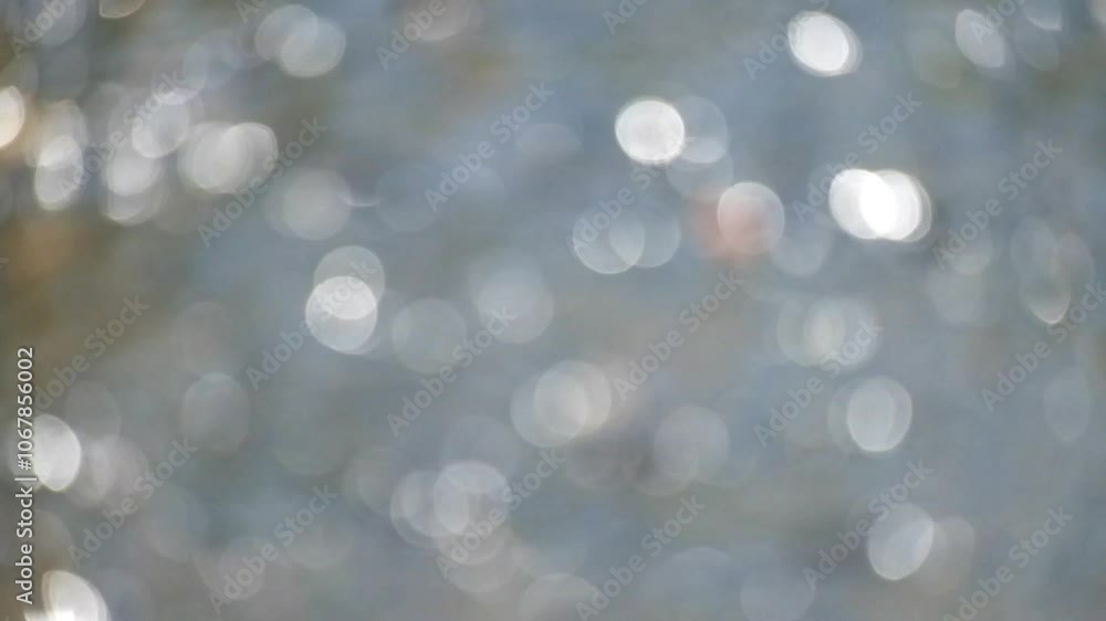 Poster twinkling bokeh sparkling river water illuminated by sunlight.abstract shapes, patterns and textures