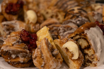 Close up of pastry rolls on white platter