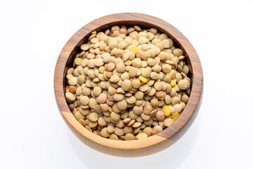 Brown Lentils in Wooden Bowl on White Background