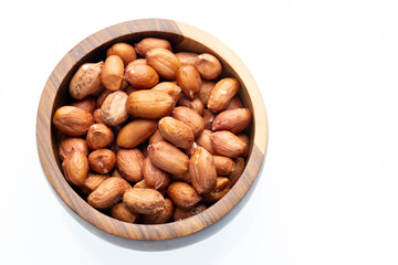 Roasted Peanuts in Wooden Bowl on White Background