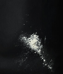 White snow falling down on black background