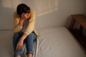 Depressed young asian woman with mental health problem in mind need crucial treatment from...