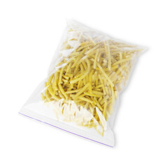 Frozen yellow beans in plastic bag isolated on white, top view