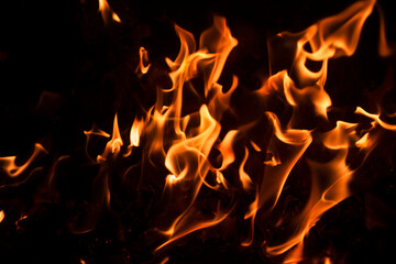 Blaze fire flame texture background. Fire sparks background. Abstract fire flame texture for banner background. Flaming burning effect. Abstract art pattern with copy space. © Korneliia