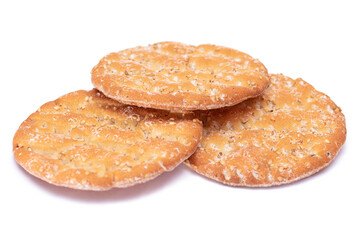 A Heap of Round Salt Crackers with Sesame Isolated on White Background. Dry Snacks - Isolation