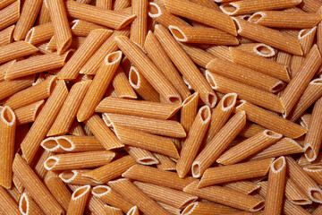 Uncooked Whole Grain Penne Rigate Pasta: A Culinary Canvas of Whole Wheat Macaroni, Creating a...