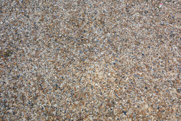 A rocky surface with a lot of small rocks scattered around