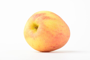 Fresh ripe apple with tiny water drops on white background
