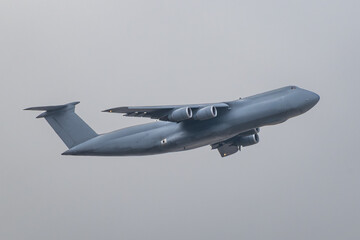 Large Cargo Jet Climbing into the Sky