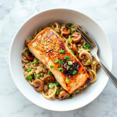 Seared Salmon with Mushroom Risotto in a Pasta Bowl, Marinated salmon fish fillet on a bed of mushroom risotto with scallions and sesame seed garnish