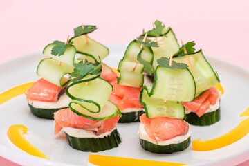 Canapes without Bread with Fresh Salmon, Cucumber and Cream Cheese on White Plate. Easy Breakfast....