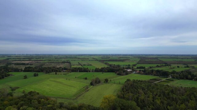 moore plowed field bordering forest in germany Majestic aerial view flight drone