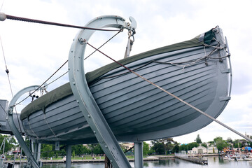 grey lifeboat hanging on ship