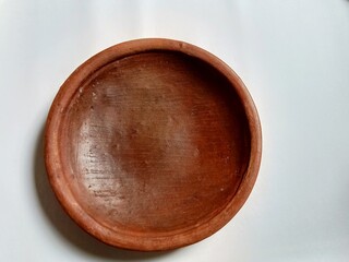 Traditional clay mortar, on a white background.