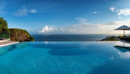 A luxury hotel infinity pool with the ocean at its edge