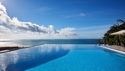 A luxury hotel infinity pool with the ocean at its edge